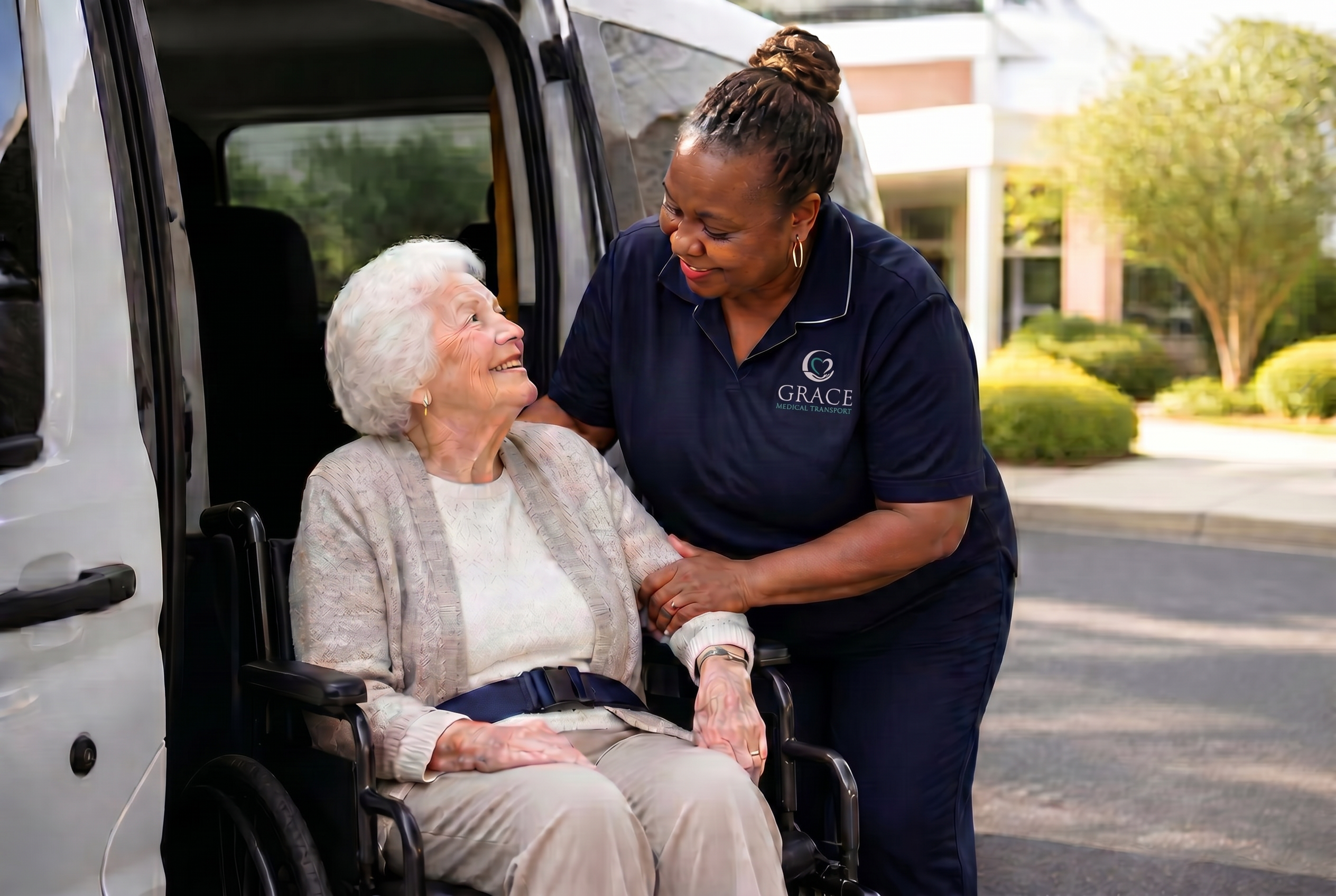 Compassionate Grace Medical Transport driver assisting a smiling elderly passenger into an accessible van